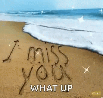 I Miss You Written in Sand on Beach