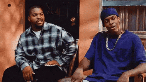 Ice Cube And Snoop Dogg Are Sitting On A Porch Talking To Each Other GIF