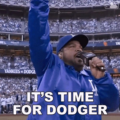 Ice Cube Says It 'S Time For Dodger While Holding A Microphone GIF