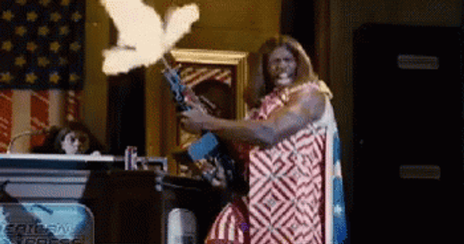 Idiocracy Terry Crews Holding Gun While Shooting GIF