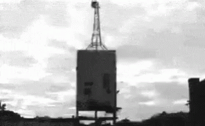 Implosion Of Building With Signal Tower GIF