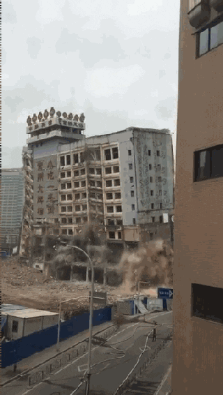 Implosion Of Establishment Beside Road GIF