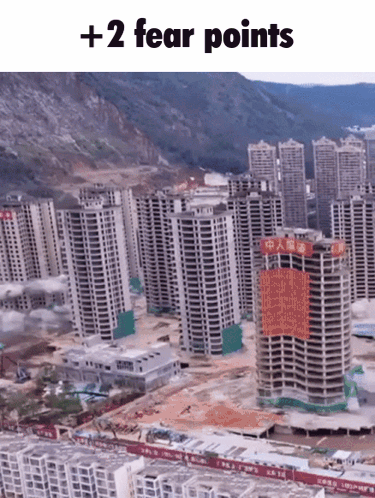Implosion Of Several Buildings Aerial View GIF