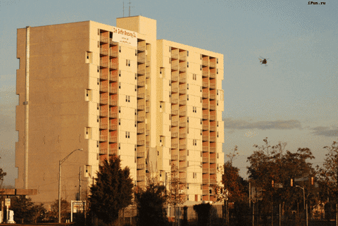 Implosion Of White Multi Story Building GIF