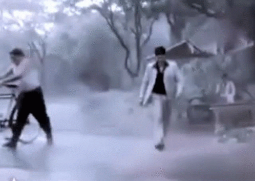 Indian Guy Playing In Monsoon Water GIF