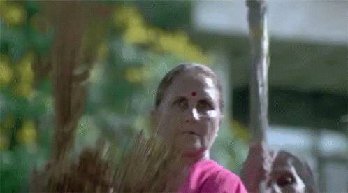 Indian Mothers Holding A Broom GIF