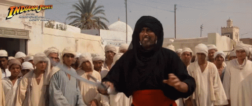 Indiana Jones Poster Man Holding Sword in Front of Crowd