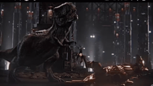 Indominus Rex Playing With Velociraptor GIF