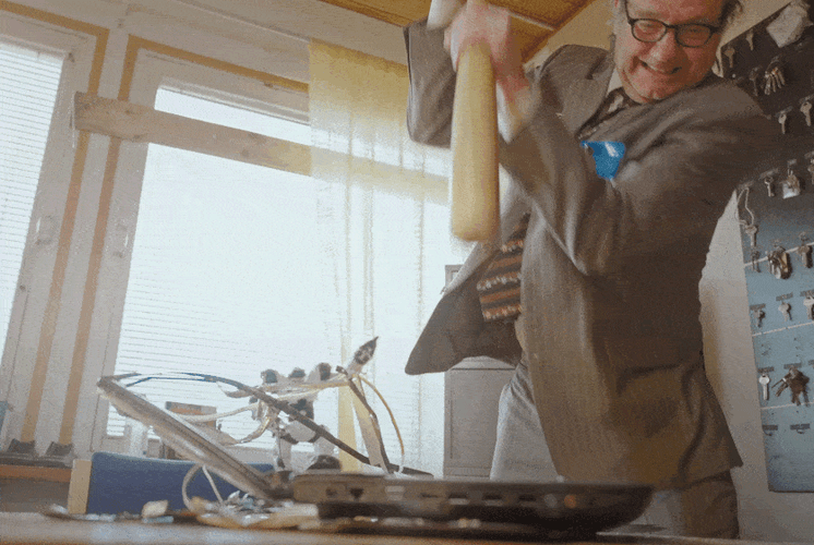 Infuriated Man Smashing Computer With Bat GIF