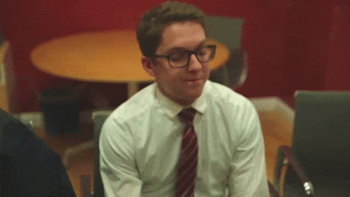 Interview Nerd Guy Touching Eyeglasses GIF