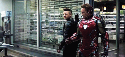Iron Man and Hawkeye Standing in a Room