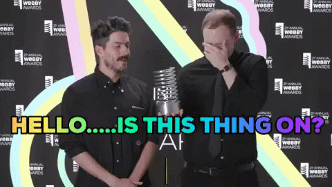 Is This Thing On Reaching For Mic GIF