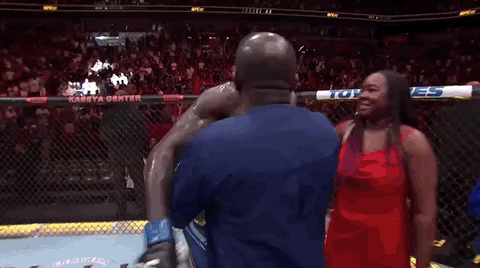 Israel Adesanya Embracing His Family GIF