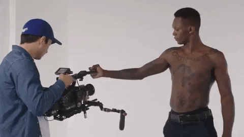 Israel Adesanya Flexing His Bicep GIF
