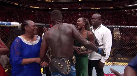 Israel Adesanya Hugging And Kissing Loved Ones GIF