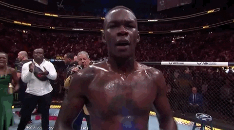 Israel Adesanya Making Himself Smile GIF