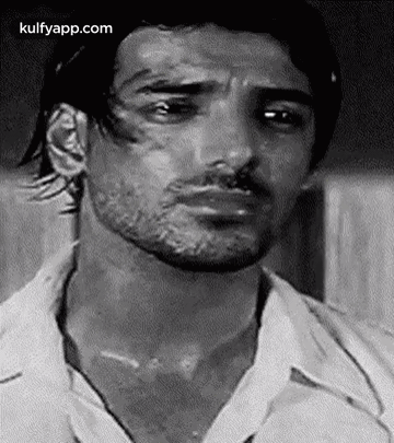 It Is A Black And White Photo Of A Man With A Beard . GIF