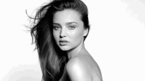 It Is A Black And White Photo Of A Naked Woman With Long Hair . GIF