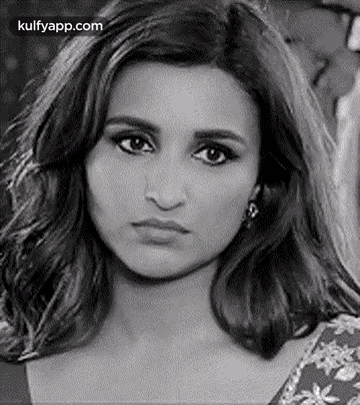 It Is A Black And White Photo Of A Woman Making A Funny Face . GIF