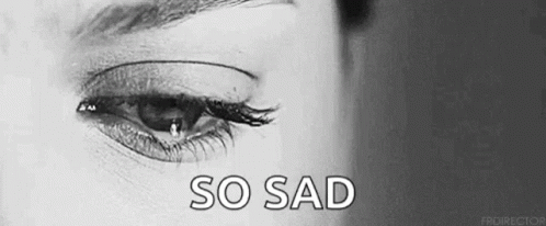 It Is A Black And White Photo Of A Woman 'S Eye With A Tear Coming Out Of It . GIF