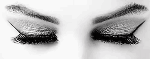 It Is A Black And White Photo Of A Woman 'S Eyes With Long Eyelashes . GIF
