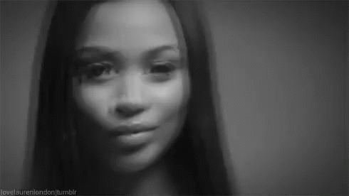 It Is A Black And White Photo Of A Woman 'S Face . GIF