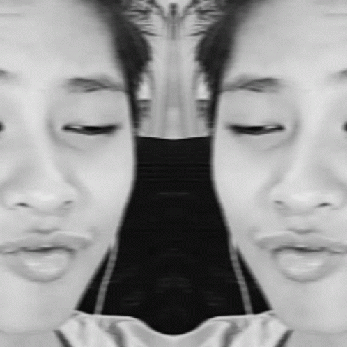 It Is A Black And White Photo Of A Woman 'S Face . GIF