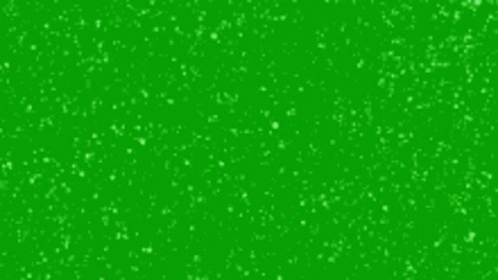 It Looks Like Snow Is Falling On A Green Background . GIF