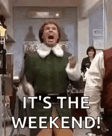 It 'S The Weekend ! A Man In A Green Shirt Is Standing In A Room With His Mouth Open . GIF