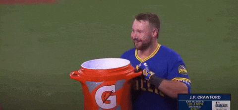 J.p. Crawford Holds A Gatorade Bucket On A Baseball Field GIF