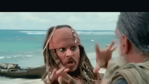 Jack Sparrow From Pirates Of The Caribbean Is Talking To An Older Man On The Beach . GIF