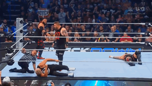 Jacob Fatu Kicking Kevin Owens Before Falling GIF