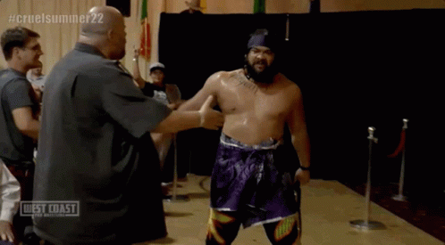 Jacob Fatu Placing Wrestling Belt On Shoulder GIF