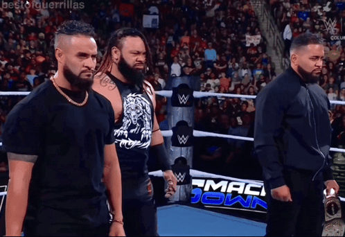 Jacob Fatu Standing In Middle Of Two Guys GIF