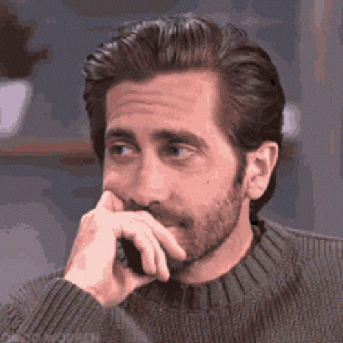 Jake Gyllenhaal Thinking Flirty Wink GIF