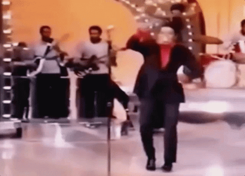 James Brown Doing A Funny Dance While Smiling GIF