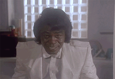 James Brown In A White Suit Is Smiling GIF