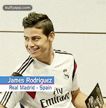 James Rodriguez Smiling Holding Book