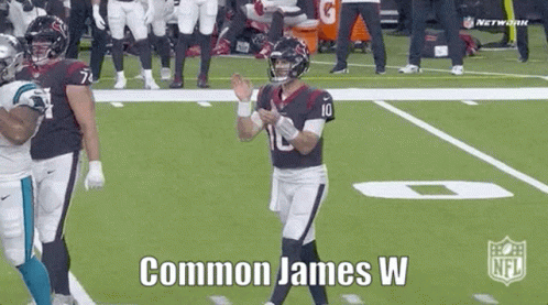 James W Football Player Standing on Field