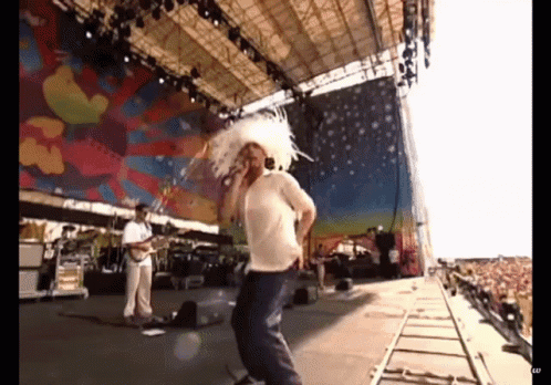 Jamiroquai Jay Kay Doing Thug Shaker On Stage GIF