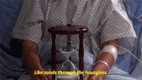 Janet Spears Holding An Hourglass GIF