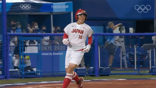 Japanese Baseball Player Running to Home Plate
