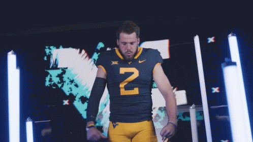 Jarret Doege Mountaineers Player Flexing And Posing GIF
