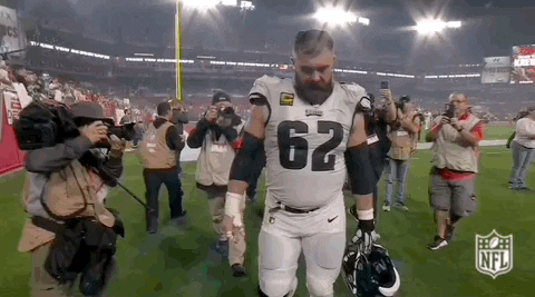 Jason Kelce Raising His Football Helmet GIF