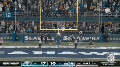 Jason Kelce Sitting While Talking To Teammate GIF