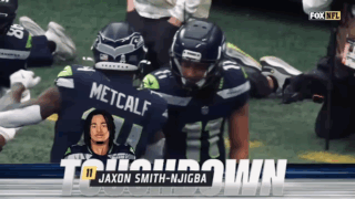 jaxon smith and metcalf celebrate a touchdown