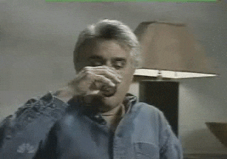Jay Leno Surprised And Spit Out The Water GIF