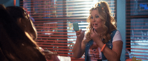 Jennifer Coolidge Putting On A Lipstick GIF