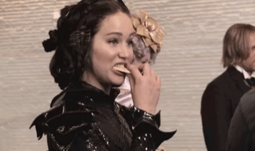Jennifer Lawrence Eating On Hunger Games Set GIF