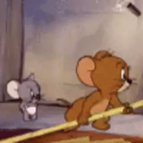 Jerry and Mouse Standing Next to Each Other